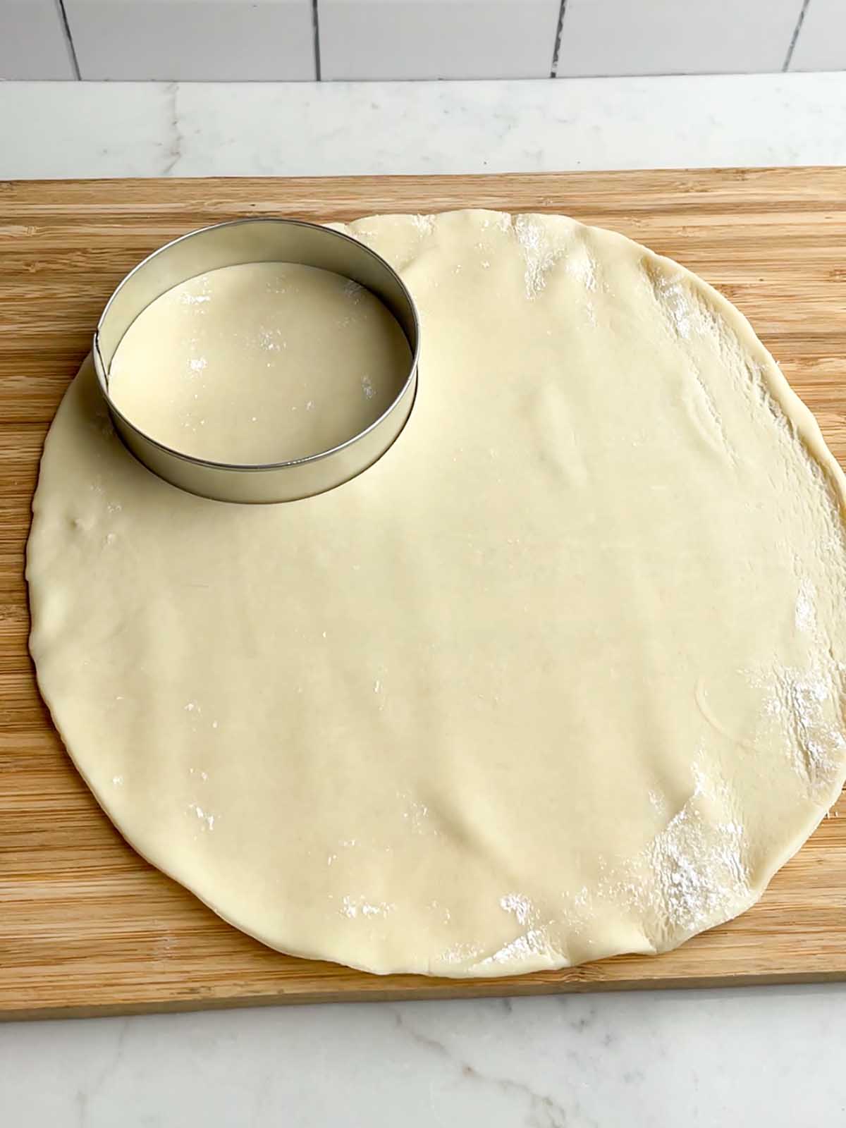 pie dough with a round cookie cutter