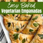 baked vegetarian empanadas on a white platter