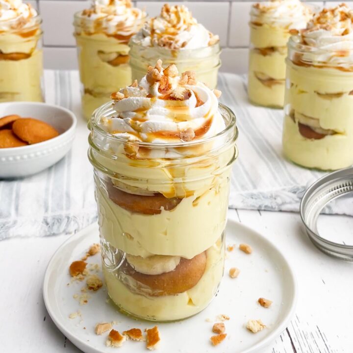 banana pudding cup in a mason jar on a white plate