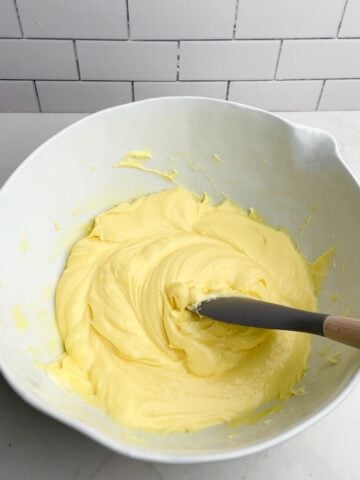 cream cheese pudding mixture in a white mixing bowl.