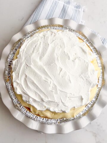 Cool Whip spread on top of banana pudding pie.
