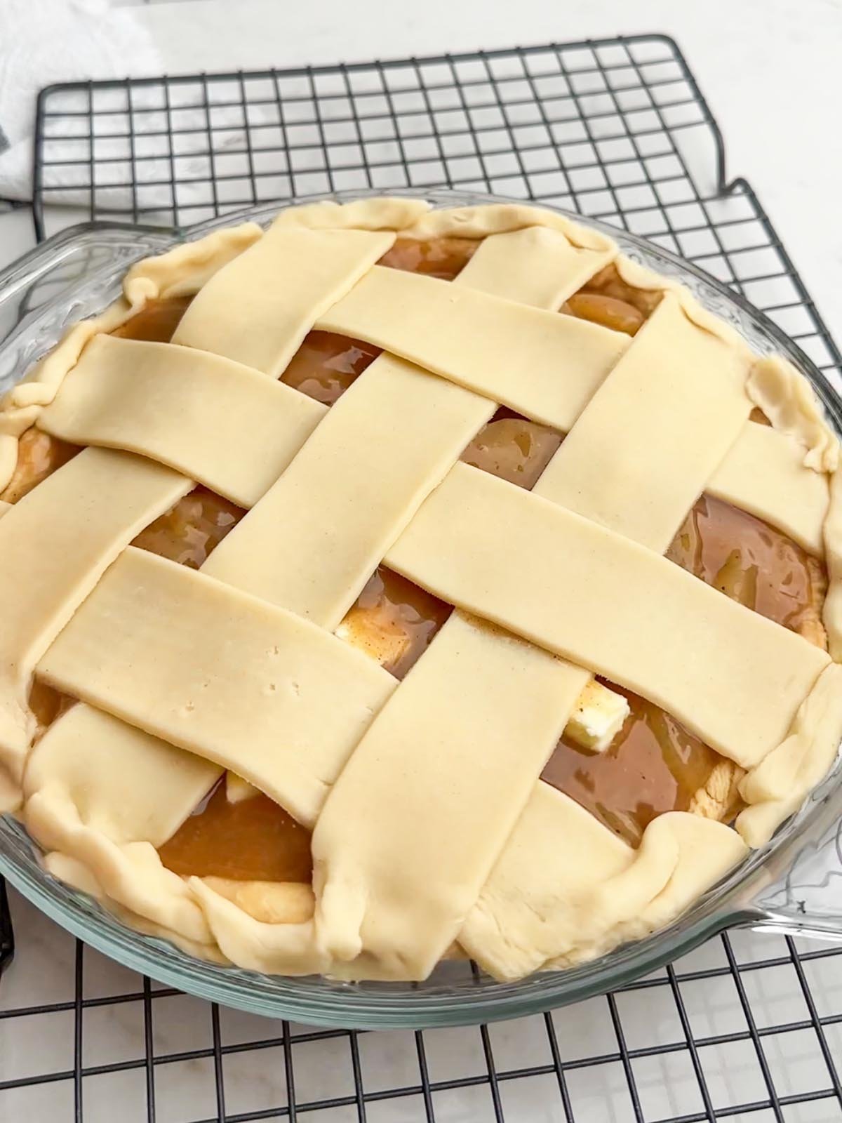 Completed lattice top crust on apple pie.
