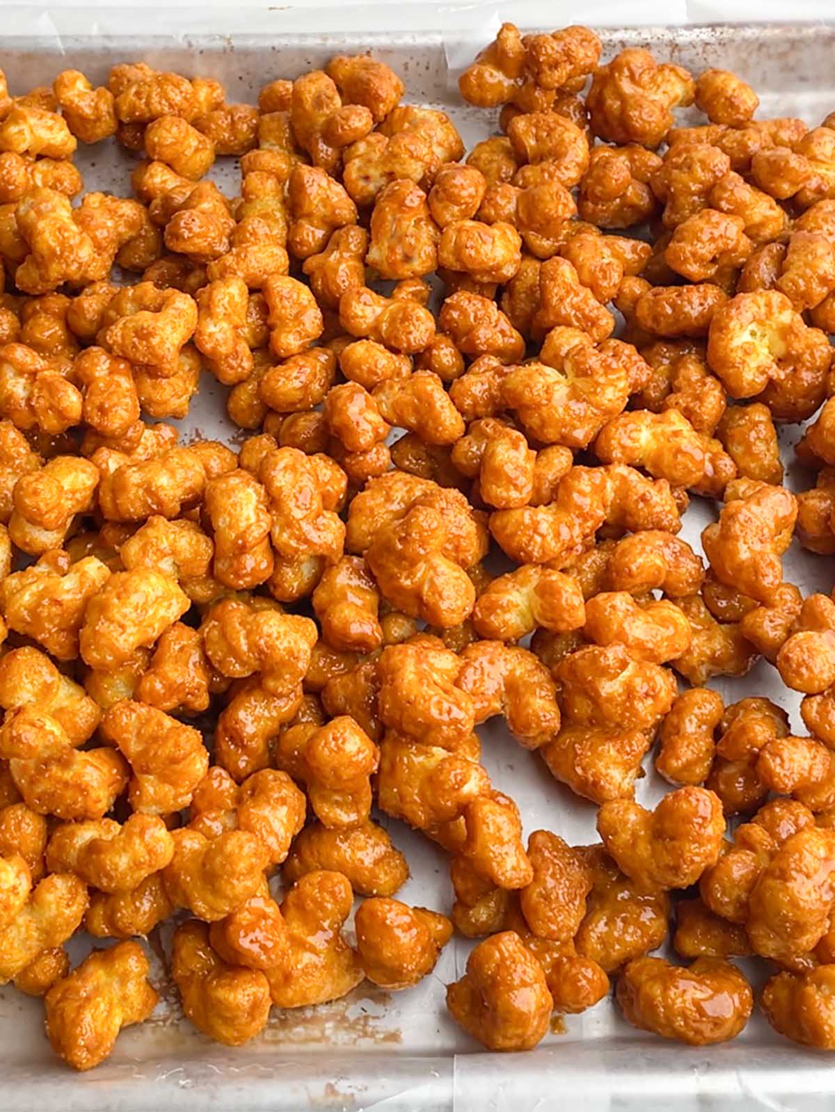 Caramel Puff Corn Recipe without Corn Syrup cooling on wax paper