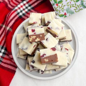 squares of Christmas fudge on a white plate