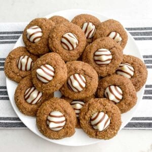 coffee cookies with Hershey's Kisses Hugs on a white plate