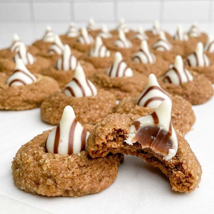 coffee cookies with Hershey's Kisses Hugs on parchment paper