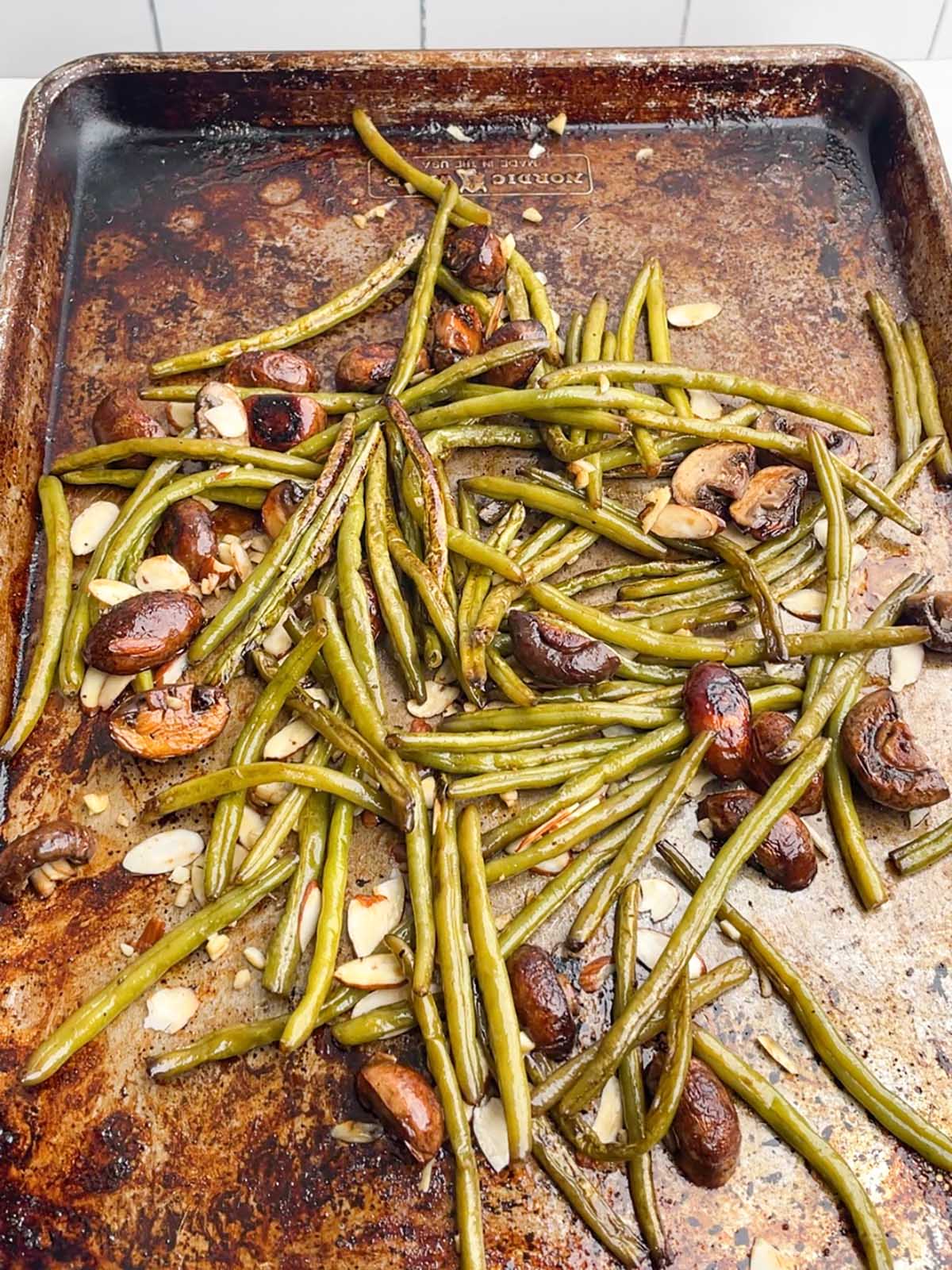 green beans and mushrooms on a sheet pan