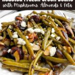 roasted green beans and mushrooms on a white plate