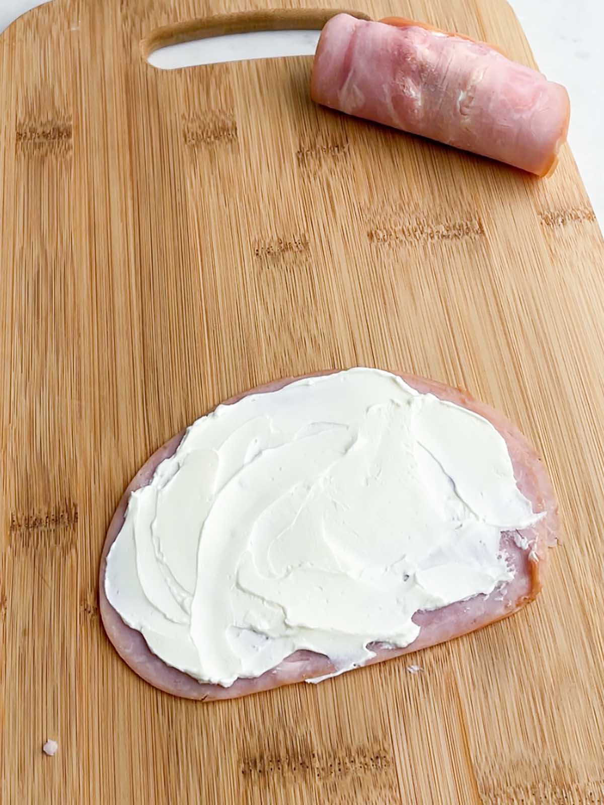 cream cheese spread on a slice of ham