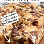 hello dolly bars on a wooden cutting board.