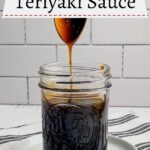 spoon drizzling honey teriyaki sauce into a mason jar of sauce