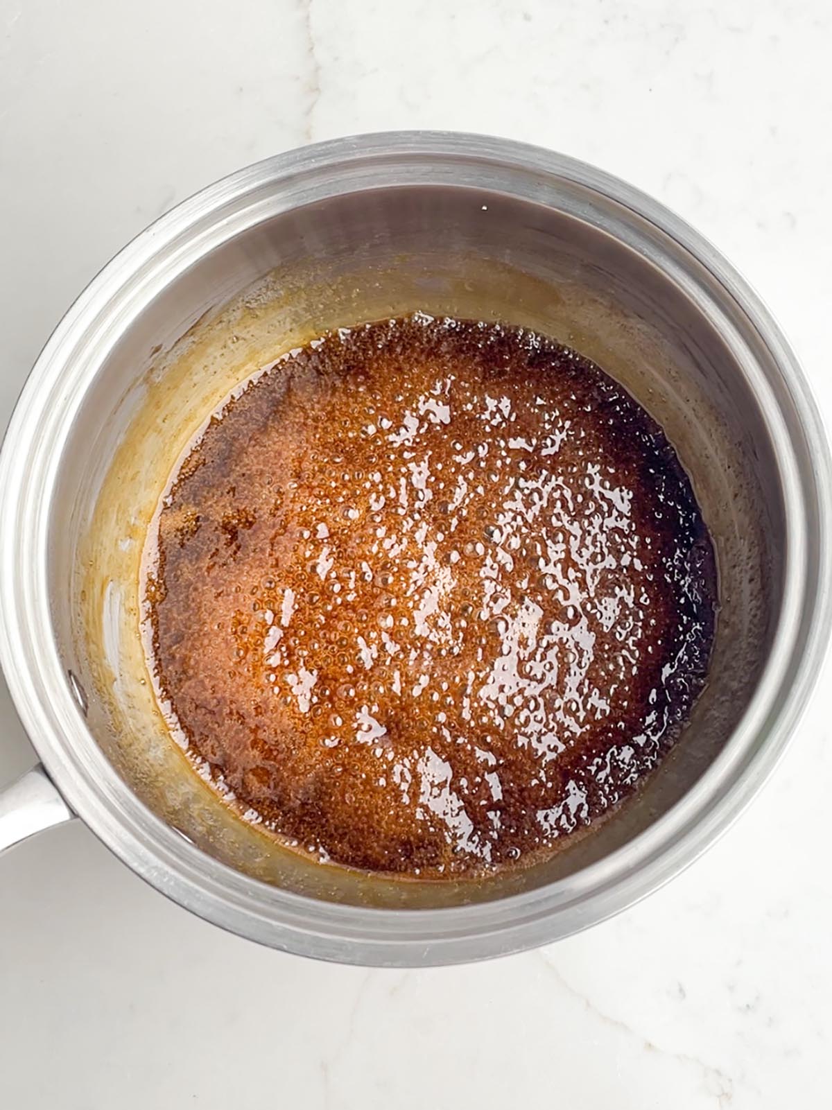 brown sugar pineapple glaze simmering in a saucepan.