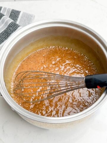caramel sauce simmering in a saucepan.