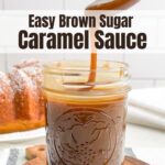spoon drizzling caramel sauce into a mason jar on a wooden board