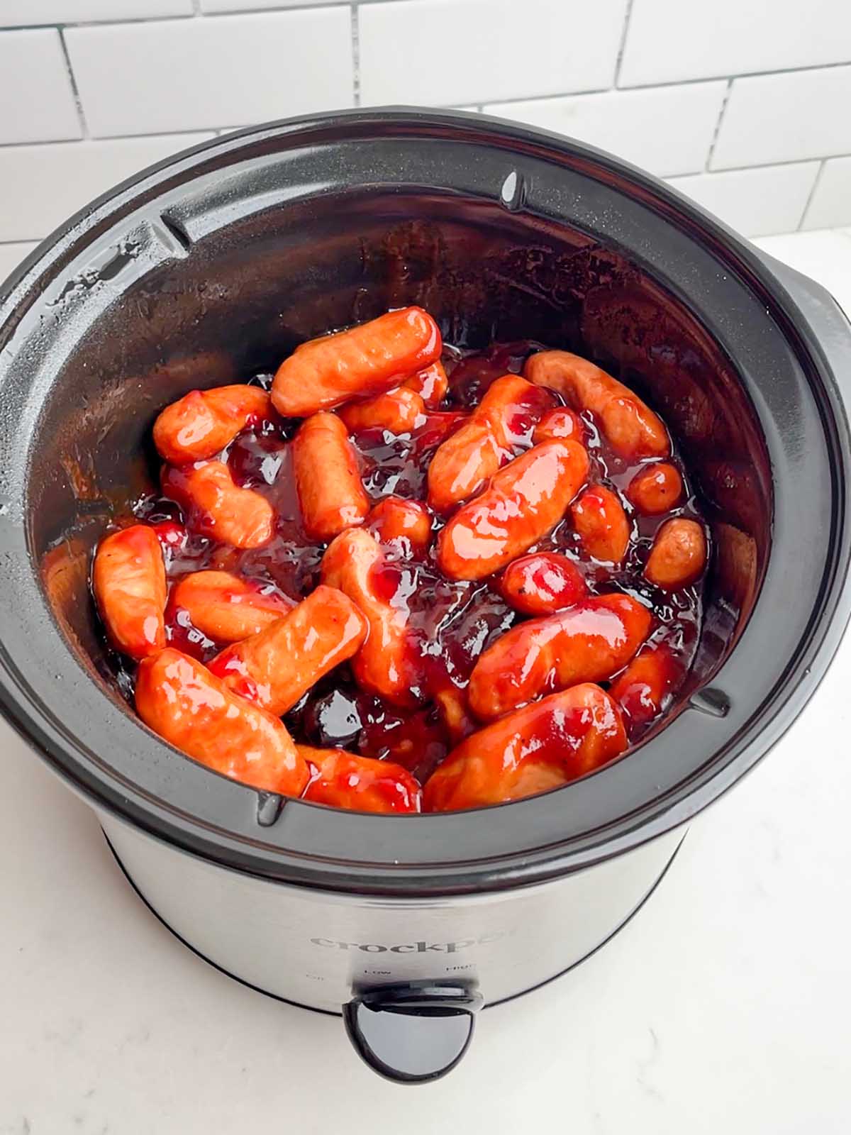 lil smokies with grape jelly and BBQ sauce in a crock pot.