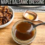 spoonful of maple balsamic dressing over a short jar of dressing