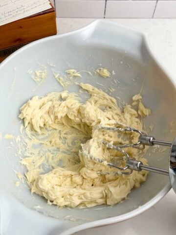 creamed sugar and butter in a white bowl.