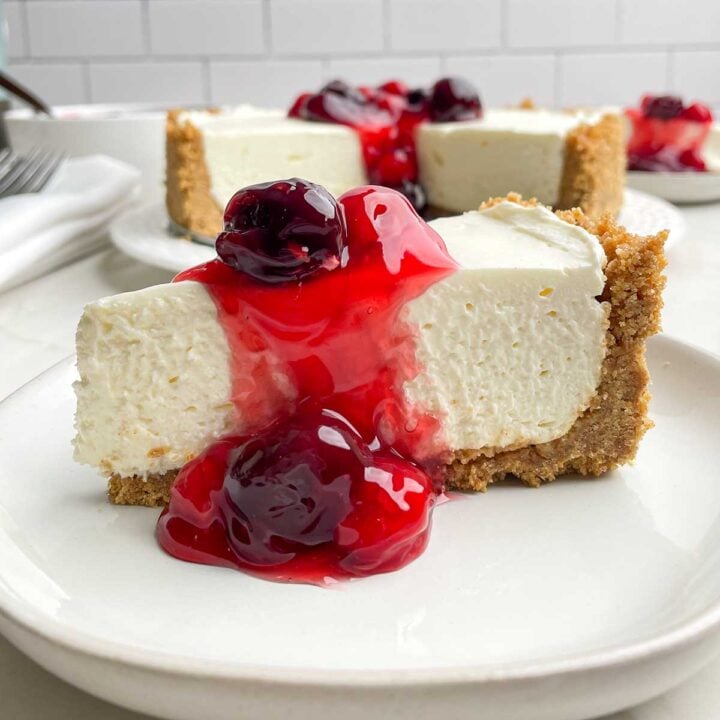 piece of no-bake cheesecake with cherry topping