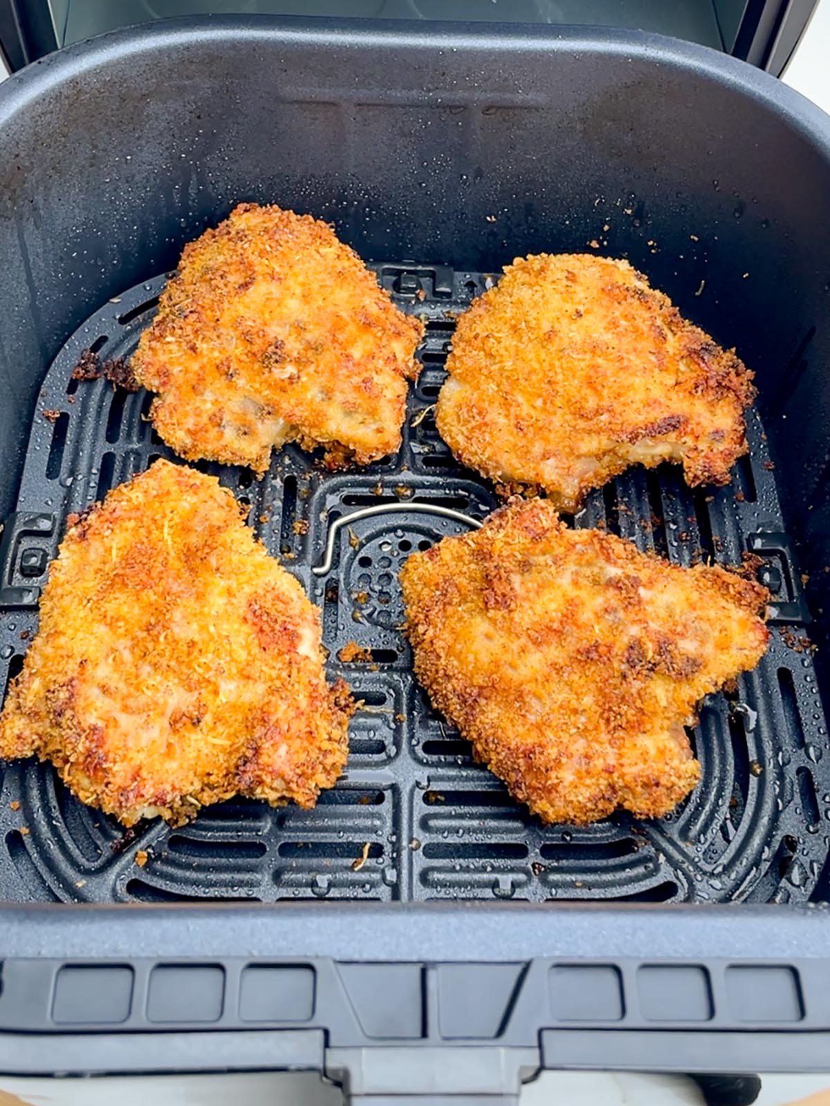 cooked panko coated bone-in chicken thighs in air fryer