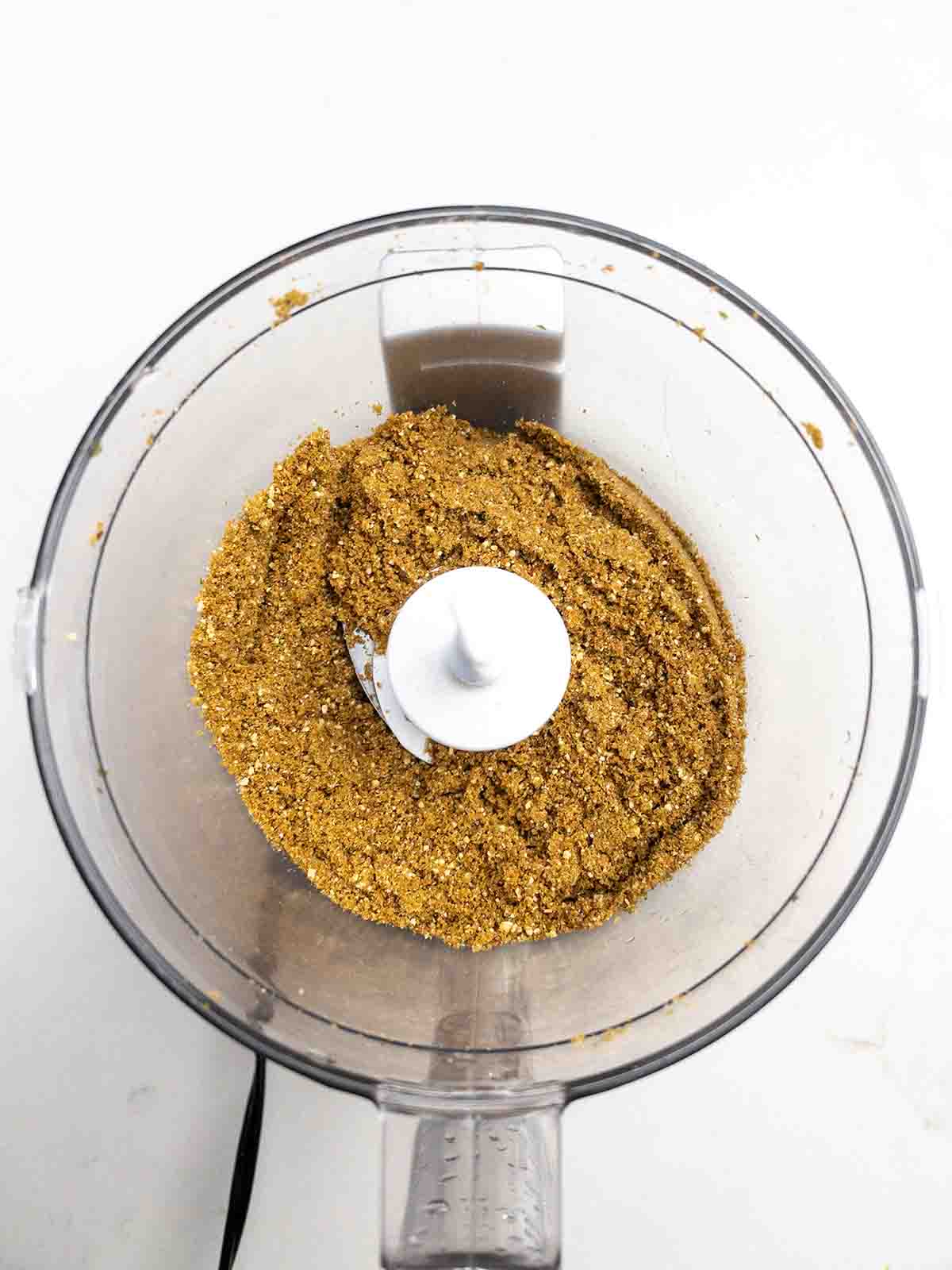 gingersnaps and pepita crumbs in a food processor