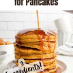 pumpkin syrup pouring over stack of pancakes.