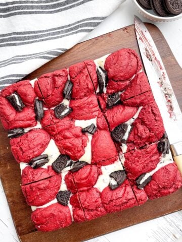 baked red velvet brownies from cake mix on a wood cutting board.