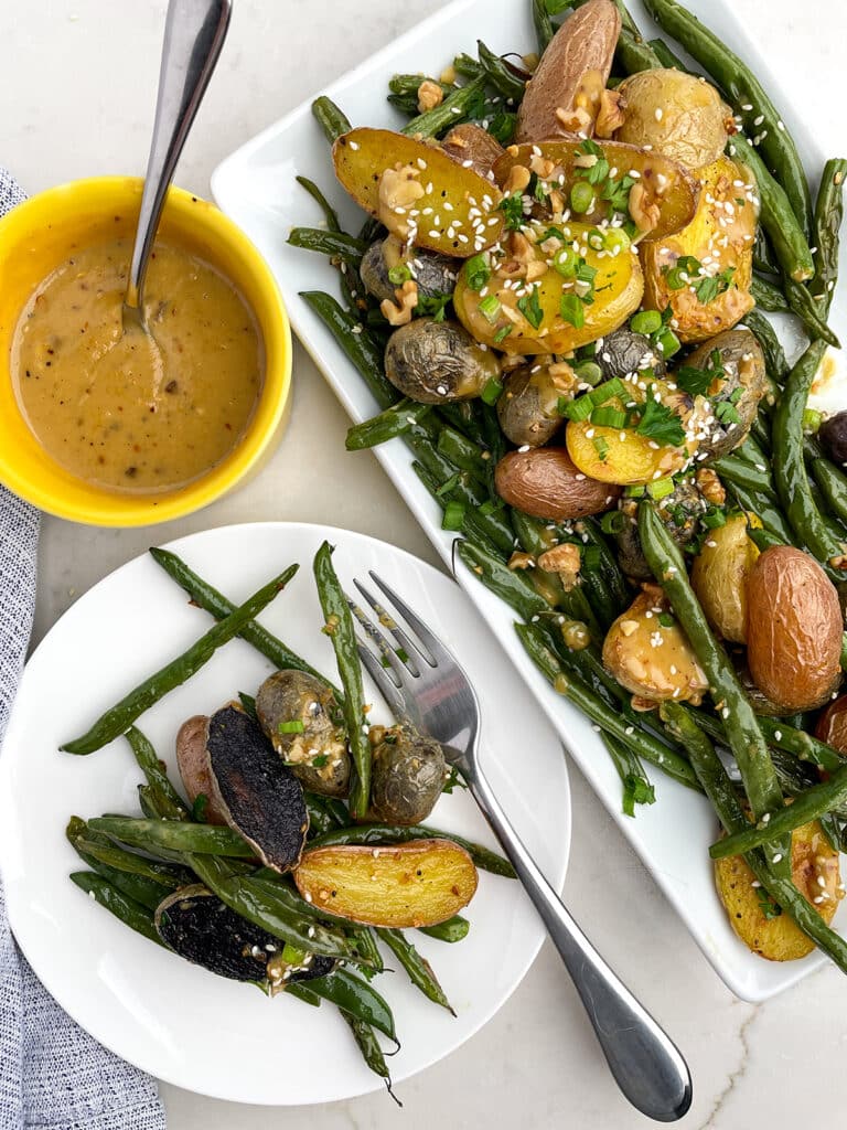 Roasted Potatoes and Green Beans with a plate and fork