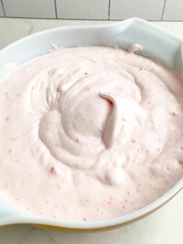 strawberry angel food cake batter in a white bowl.