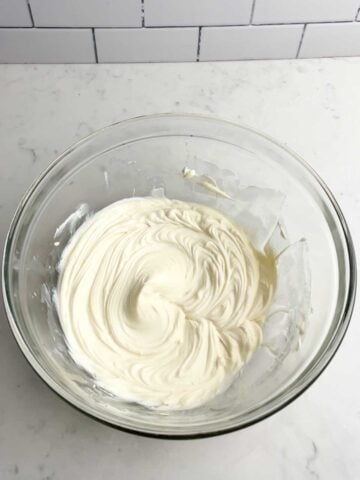 cream cheese filling in a clear bowl.