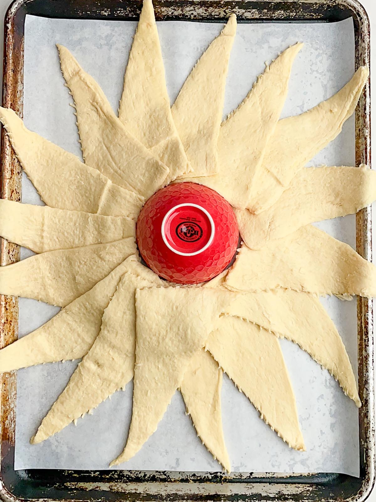 crescent roll dough arranged in the shape of the sun