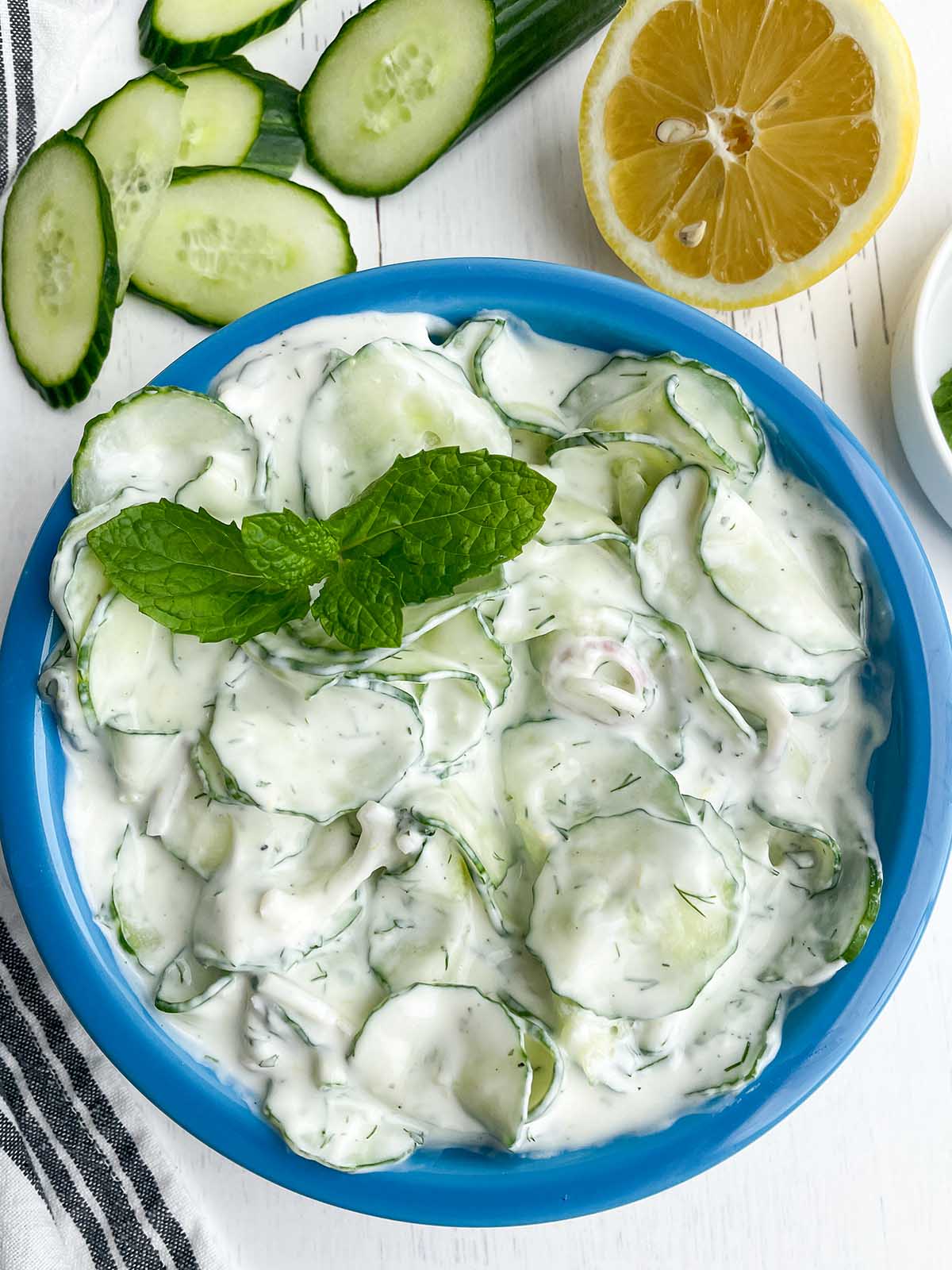 blue bowl of tzatziki greek cucumber salad