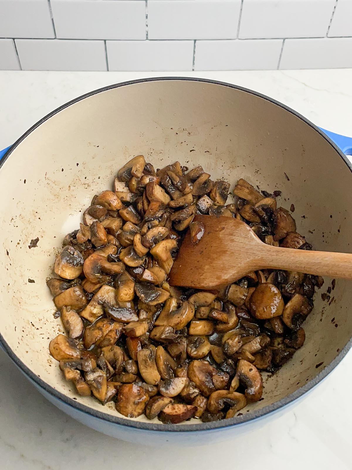sauteed mushrooms in a dutch oven