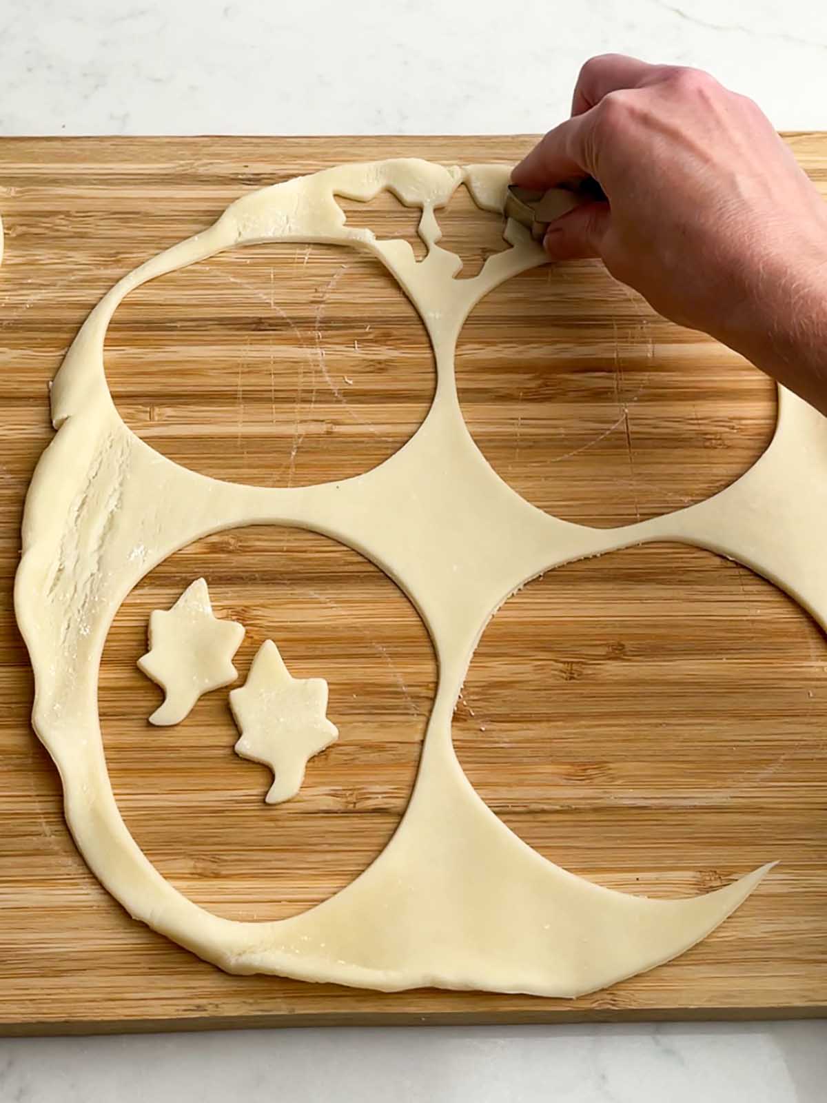 cutting out shapes in pie crust